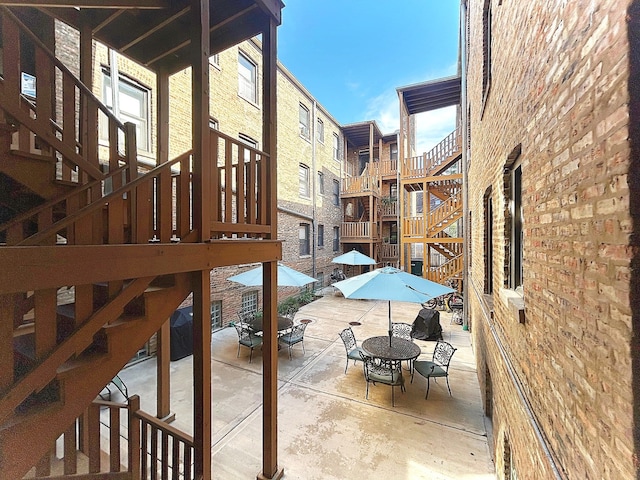 629 Garfield St Unit 1N, Oak Park, IL 60304 - view of patio featuring outdoor dining area and stairway