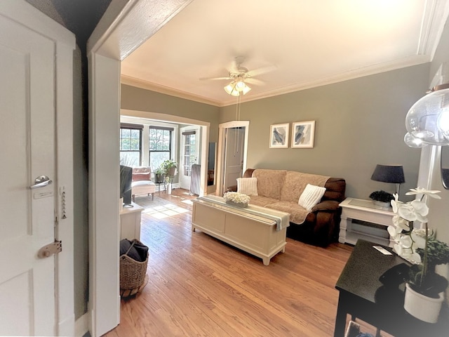 629 Garfield St Unit 1N, Oak Park, IL 60304 - living area with light wood-style flooring, a ceiling fan, and crown molding