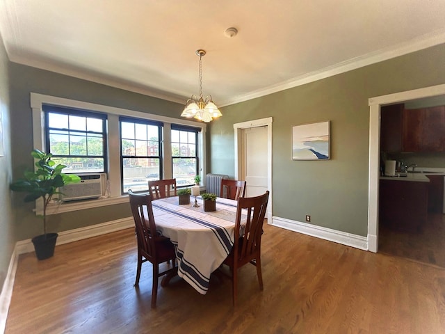629 Garfield St Unit 1N, Oak Park, IL 60304 - dining area with cooling unit, a chandelier, ornamental molding, and dark wood finished floors