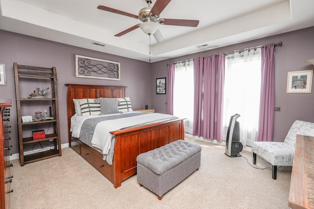 236 Marquette Pl S, Manteno, IL 60950 - carpeted bedroom with a tray ceiling and a ceiling fan