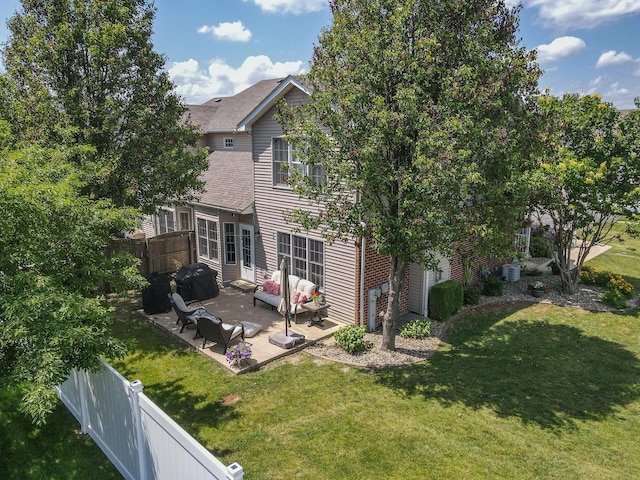 236 Marquette Pl S, Manteno, IL 60950 - back of house with a fenced backyard, a patio area, and a shingled roof