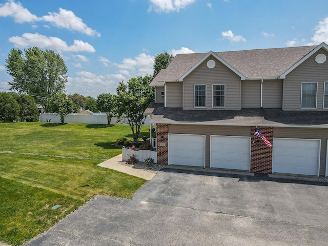 236 Marquette Pl S, Manteno, IL 60950 - view of front facade featuring a garage, a shingled roof, asphalt driveway, and brick siding