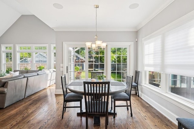 924 Linden Ave, Wilmette, IL 60091 - dining room featuring a chandelier, dark wood-style flooring, and lofted ceiling