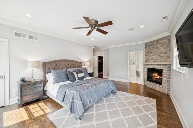 924 Linden Ave, Wilmette, IL 60091 - bedroom with wood finished floors, crown molding, a stone fireplace, recessed lighting, and ensuite bathroom
