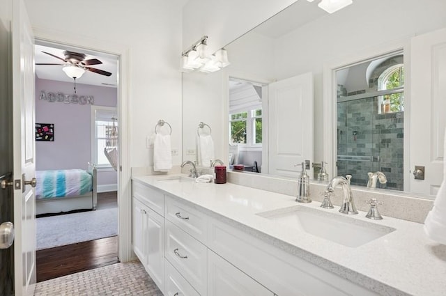 924 Linden Ave, Wilmette, IL 60091 - ensuite bathroom with double vanity, healthy amount of natural light, a shower stall, and ceiling fan