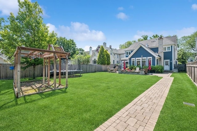 924 Linden Ave, Wilmette, IL 60091 - fenced backyard with a trampoline and a patio