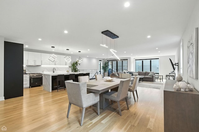 1437 W Grand Ave Unit 1S, Chicago, IL 60642 - dining room with light wood-style flooring and recessed lighting