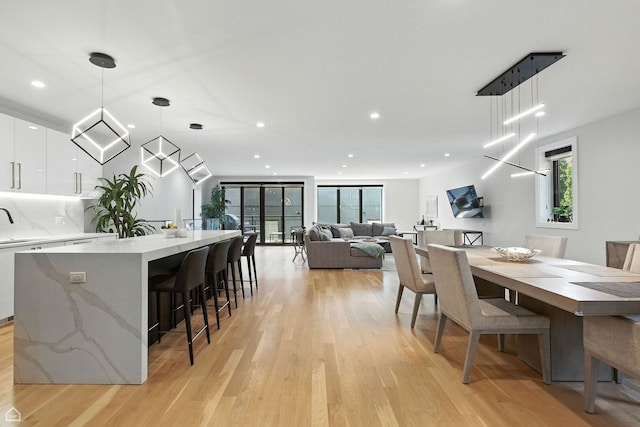 1437 W Grand Ave Unit 1S, Chicago, IL 60642 - dining space with light wood finished floors and recessed lighting
