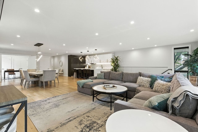 1437 W Grand Ave Unit 1S, Chicago, IL 60642 - living room featuring light wood-style flooring and recessed lighting