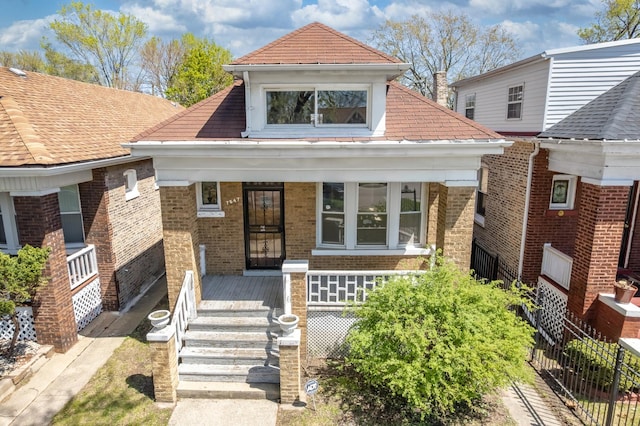 7647 S Calumet Ave, Chicago, IL 60619 - view of front facade featuring covered porch and brick siding