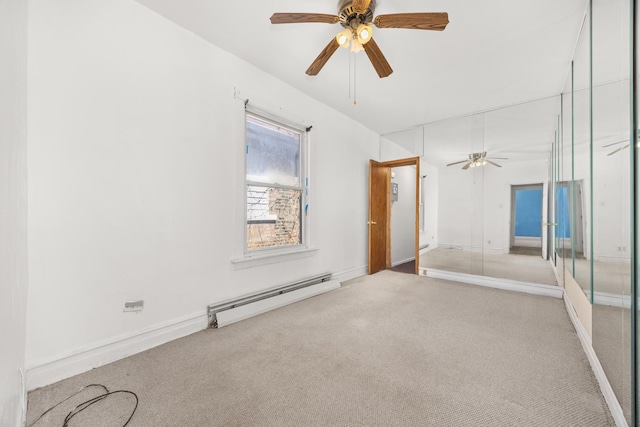 7647 S Calumet Ave, Chicago, IL 60619 - carpeted spare room featuring a baseboard heating unit and a ceiling fan