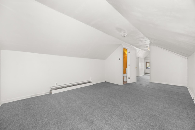 7647 S Calumet Ave, Chicago, IL 60619 - additional living space with a baseboard radiator, lofted ceiling, and dark colored carpet