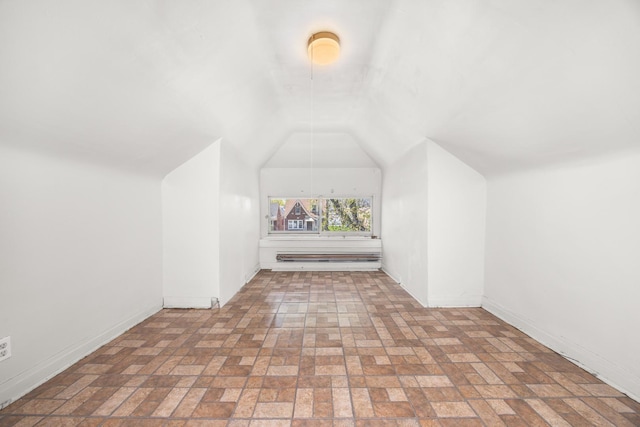 7647 S Calumet Ave, Chicago, IL 60619 - bonus room featuring brick patterned floors and vaulted ceiling