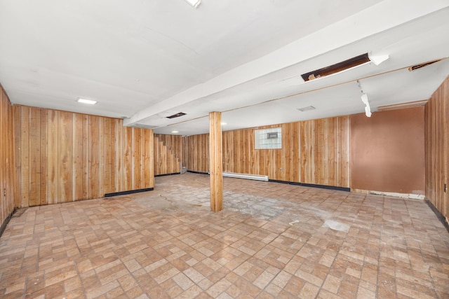 7647 S Calumet Ave, Chicago, IL 60619 - finished basement featuring brick patterned flooring, wood walls, and a baseboard radiator
