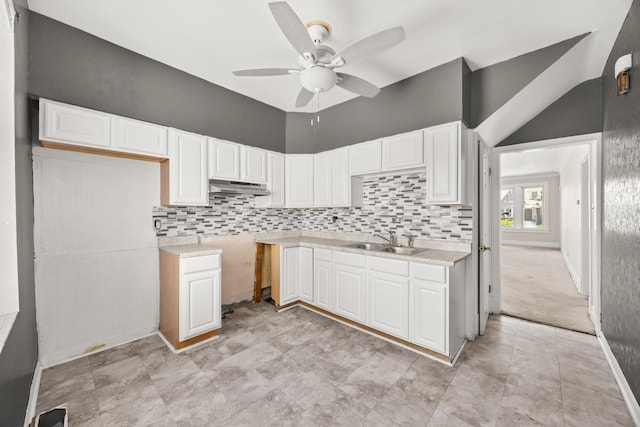 7647 S Calumet Ave, Chicago, IL 60619 - kitchen featuring under cabinet range hood, ceiling fan, white cabinets, and tasteful backsplash