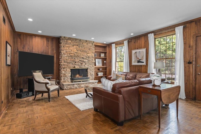 67 Brandon Rd, Northfield, IL 60093 - living area with wooden walls, a stone fireplace, built in features, recessed lighting, and crown molding