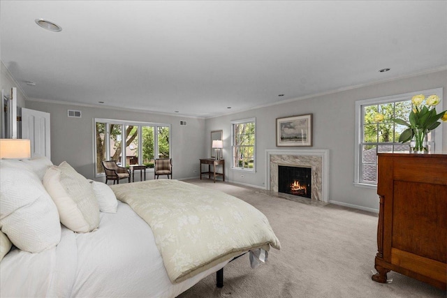 67 Brandon Rd, Northfield, IL 60093 - bedroom featuring multiple windows, light carpet, ornamental molding, a premium fireplace, and recessed lighting