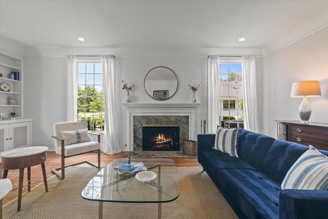 67 Brandon Rd, Northfield, IL 60093 - living room featuring ornamental molding, a fireplace, wood finished floors, recessed lighting, and built in features