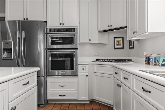 67 Brandon Rd, Northfield, IL 60093 - kitchen with stainless steel appliances, light countertops, and white cabinetry