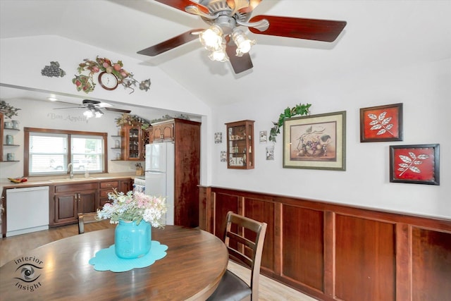 3830 W 154th Pl, Markham, IL 60428 - dining space featuring ceiling fan, vaulted ceiling, wainscoting, and light wood finished floors