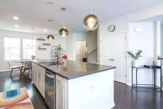 3551 Kemper Dr, Woodridge, IL 60517 - kitchen featuring stainless steel dishwasher, dark countertops, dark wood finished floors, a center island with sink, and hanging light fixtures