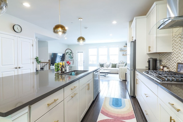 3551 Kemper Dr, Woodridge, IL 60517 - kitchen with wall chimney range hood, appliances with stainless steel finishes, open floor plan, tasteful backsplash, and white cabinets