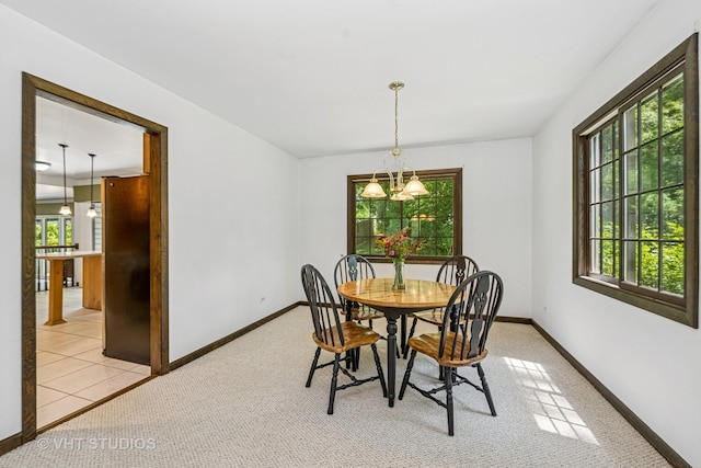 4816 Hickory Way, Johnsburg, IL 60051 - dining space featuring healthy amount of natural light, a chandelier, and light colored carpet