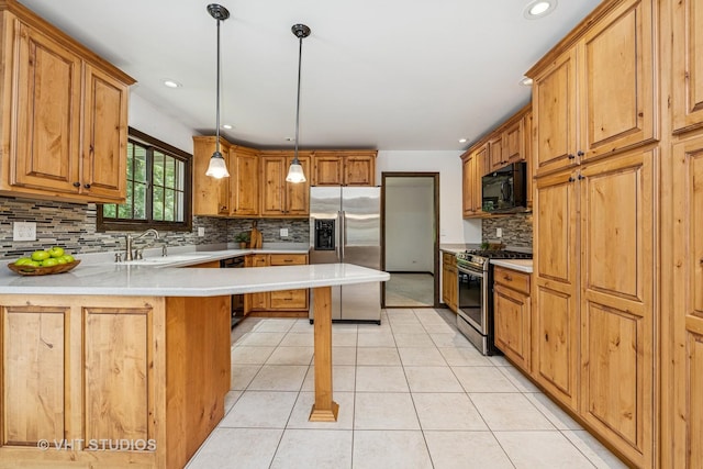 4816 Hickory Way, Johnsburg, IL 60051 - kitchen with black appliances, backsplash, light tile patterned floors, a peninsula, and light countertops