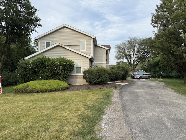 14401 Pulaski Rd, Midlothian, IL 60445 - view of property exterior featuring driveway and a lawn
