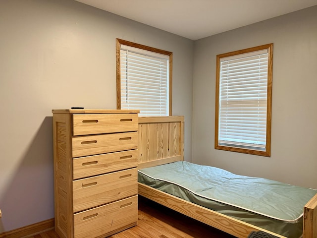 14401 Pulaski Rd, Midlothian, IL 60445 - bedroom featuring light wood-type flooring and multiple windows