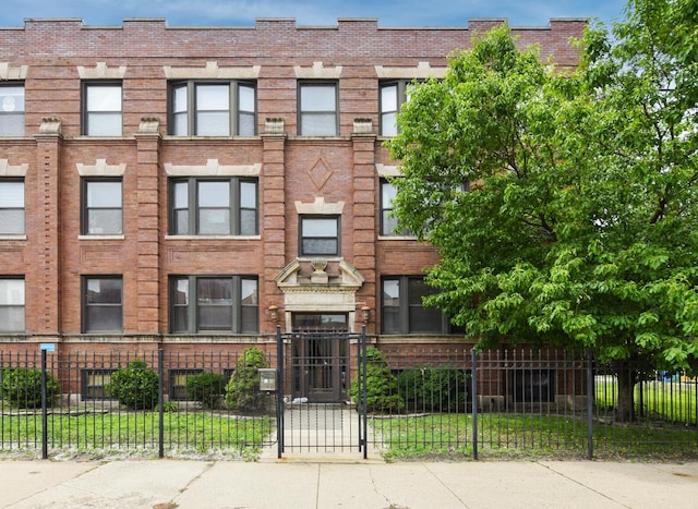 4220 S Champlain Ave Unit 2N, Chicago, IL 60653 - view of apartment building / complex featuring a fenced front yard
