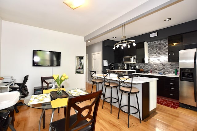 4220 S Champlain Ave Unit 2N, Chicago, IL 60653 - dining room with light wood finished floors and recessed lighting