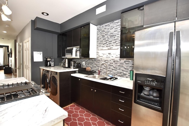 4220 S Champlain Ave Unit 2N, Chicago, IL 60653 - kitchen featuring appliances with stainless steel finishes, independent washer and dryer, backsplash, recessed lighting, and glass insert cabinets