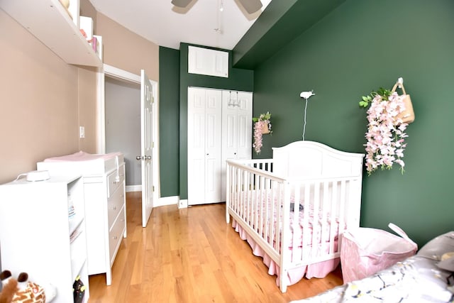 4220 S Champlain Ave Unit 2N, Chicago, IL 60653 - bedroom with a closet, light wood-type flooring, and ceiling fan