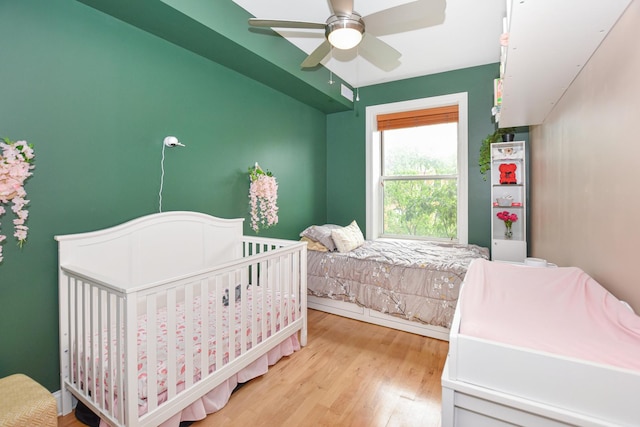 4220 S Champlain Ave Unit 2N, Chicago, IL 60653 - bedroom featuring wood finished floors and a ceiling fan