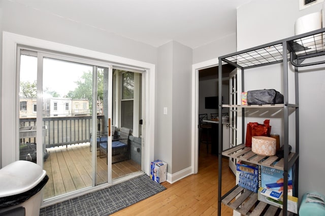 4220 S Champlain Ave Unit 2N, Chicago, IL 60653 - entryway with hardwood / wood-style flooring and baseboards