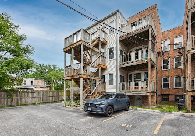 4220 S Champlain Ave Unit 2N, Chicago, IL 60653 - view of property with uncovered parking and stairway
