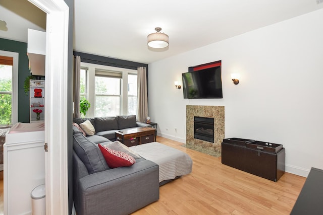 4220 S Champlain Ave Unit 2N, Chicago, IL 60653 - living room featuring a tiled fireplace and light wood finished floors