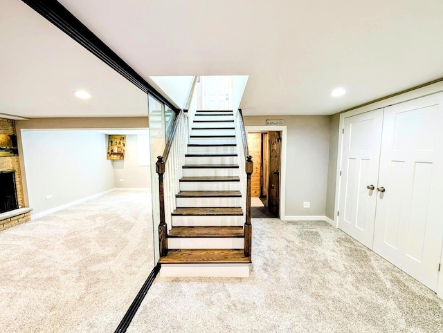 8049 Country Club Ln, North Riverside, IL 60546 - staircase with carpet floors, recessed lighting, and a stone fireplace
