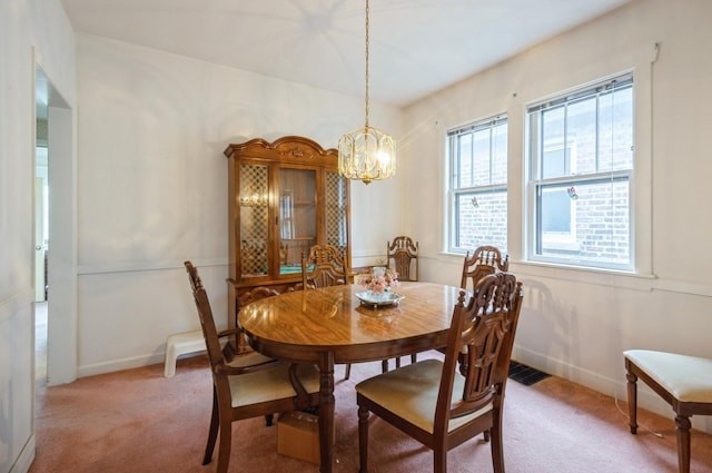 2931 N Lowell Ave, Chicago, IL 60641 - dining space with light carpet and a chandelier