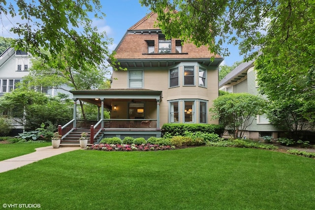 1419 Judson Ave, Evanston, IL 60201 - view of front of house featuring a porch, a front lawn, and a gambrel roof