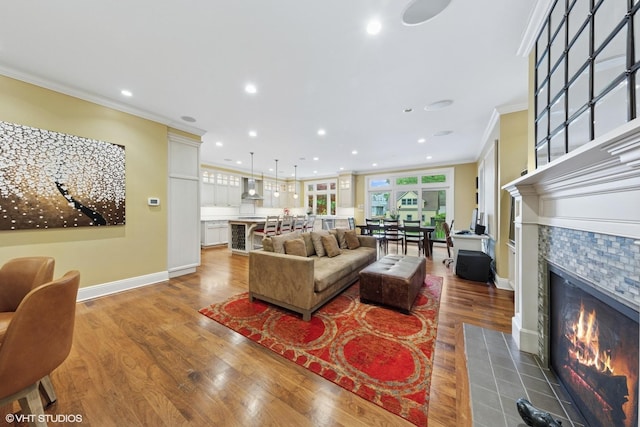 1419 Judson Ave, Evanston, IL 60201 - living area featuring ornamental molding, wood finished floors, a tile fireplace, and recessed lighting