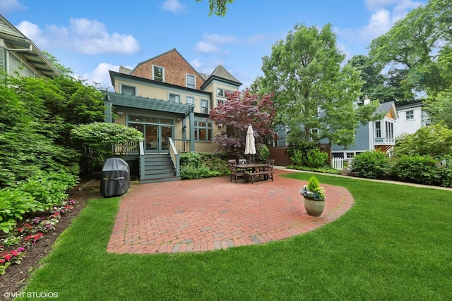 1419 Judson Ave, Evanston, IL 60201 - rear view of property featuring a lawn, a patio area, and a wooden deck