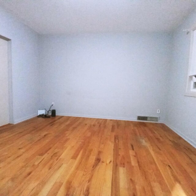 5443 S Long Ave, Chicago, IL 60638 - unfurnished room with light wood-style flooring and baseboards
