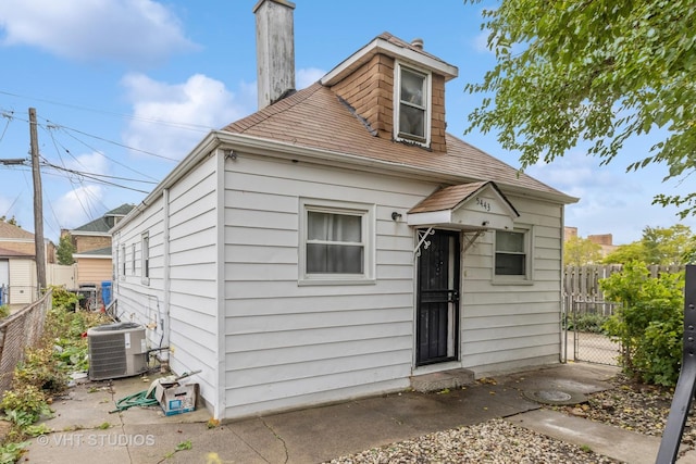 5443 S Long Ave, Chicago, IL 60638 - rear view of property with a chimney and roof with shingles