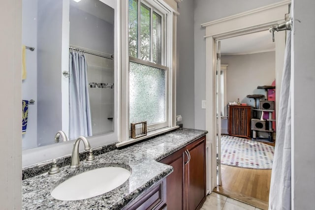5502 S Hyde Park Blvd Unit 2, Chicago, IL 60637 - full bathroom with vanity and tile patterned floors