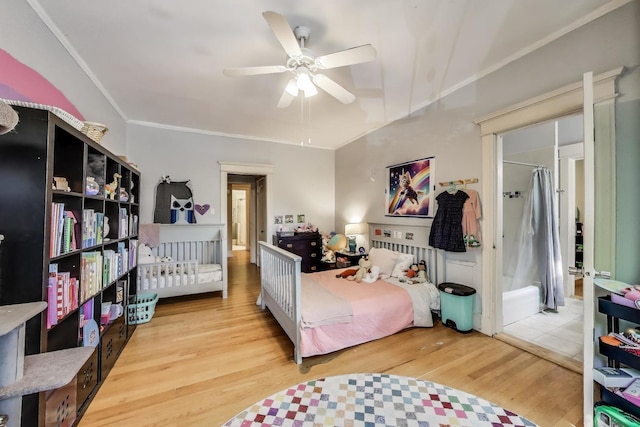 5502 S Hyde Park Blvd Unit 2, Chicago, IL 60637 - bedroom featuring light wood-type flooring, a ceiling fan, and crown molding