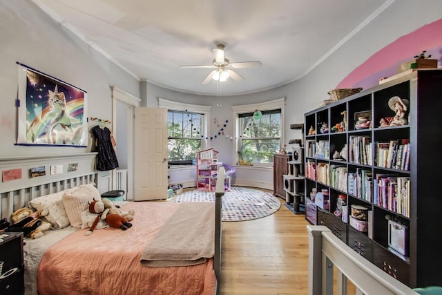 5502 S Hyde Park Blvd Unit 2, Chicago, IL 60637 - bedroom with wood finished floors, ornamental molding, and ceiling fan
