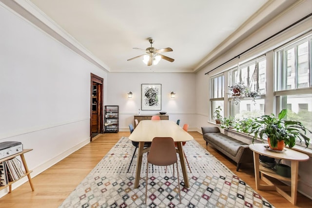 5502 S Hyde Park Blvd Unit 2, Chicago, IL 60637 - dining area with light wood-style flooring, ceiling fan, and ornamental molding