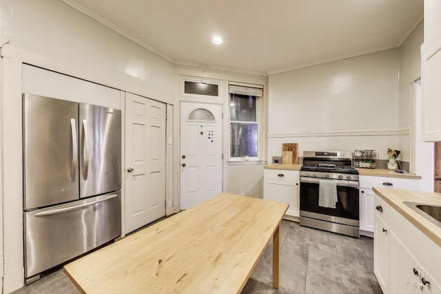 5502 S Hyde Park Blvd Unit 2, Chicago, IL 60637 - kitchen with stainless steel appliances, wood counters, white cabinetry, ornamental molding, and recessed lighting